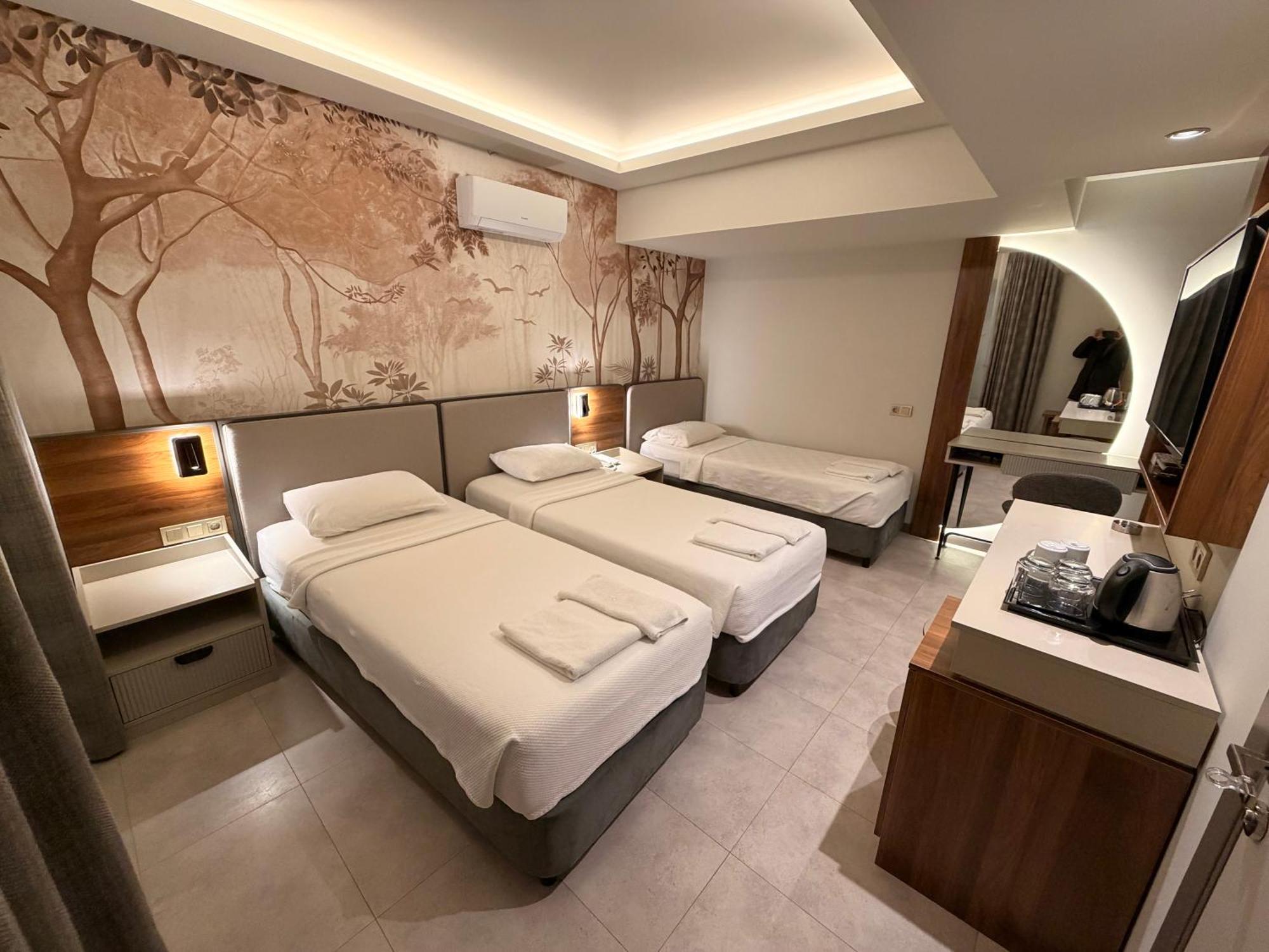 Deluxe Dreibettzimmer